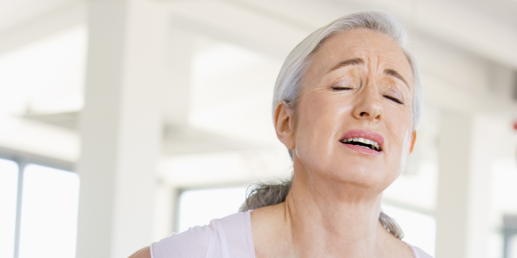 A stressed woman with back pain