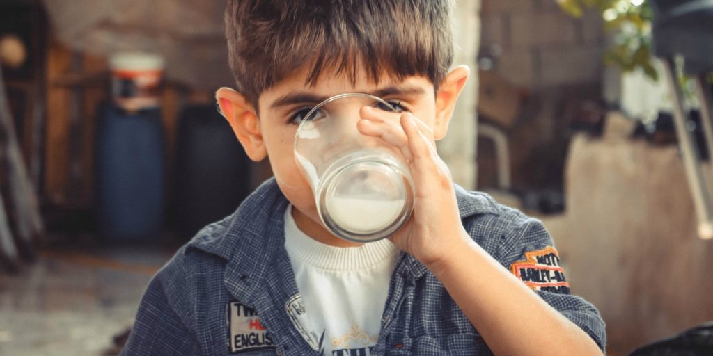 A boy drinking buttermilk