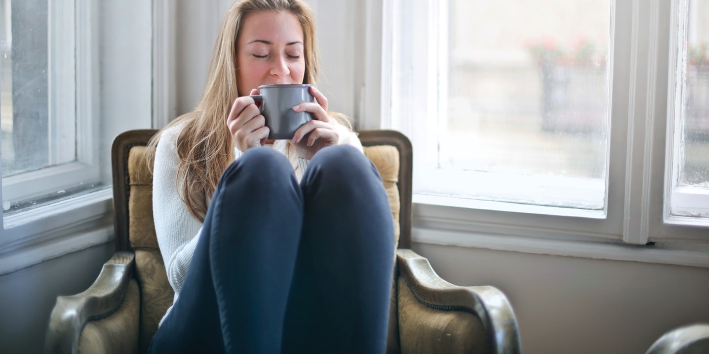 A woman sipping some tea