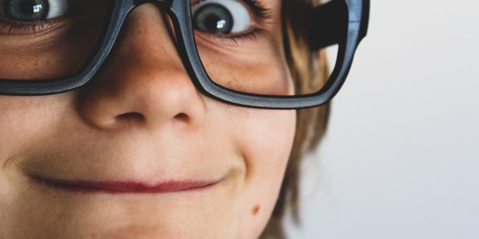 a boy wearing glasses