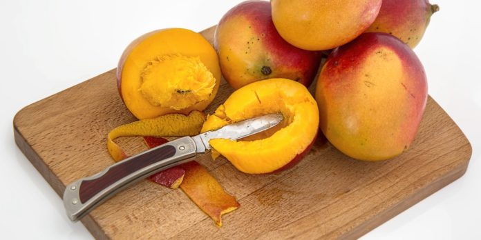 Mangoes on a chopping board