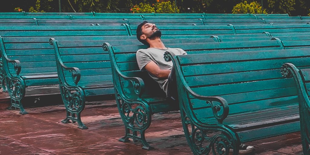 an image of a man sitting alone