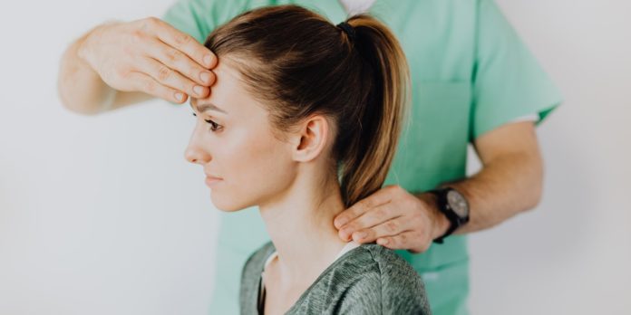 Therapist massaging patient